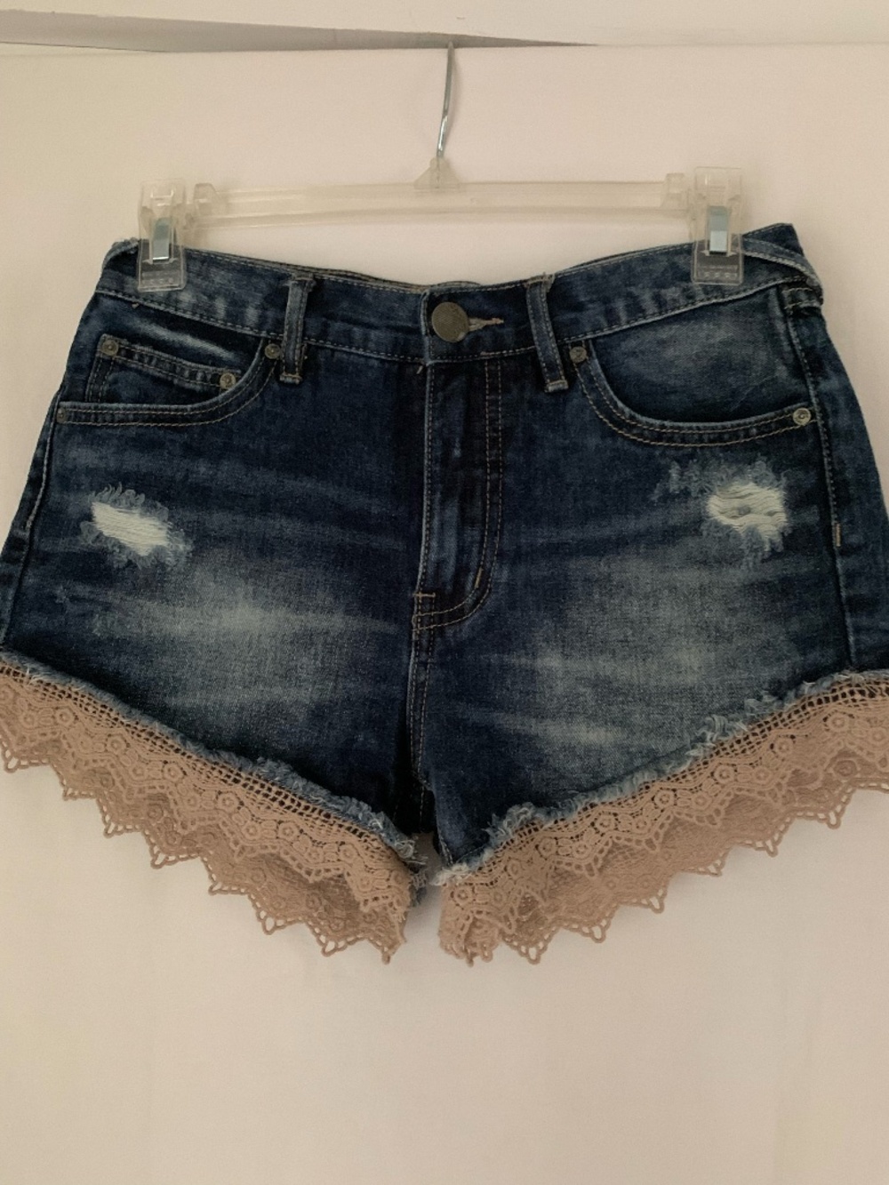 Free People distressed denim shorts with crochet lace trim
